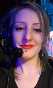 Me backstage at a theatre with a headset on.